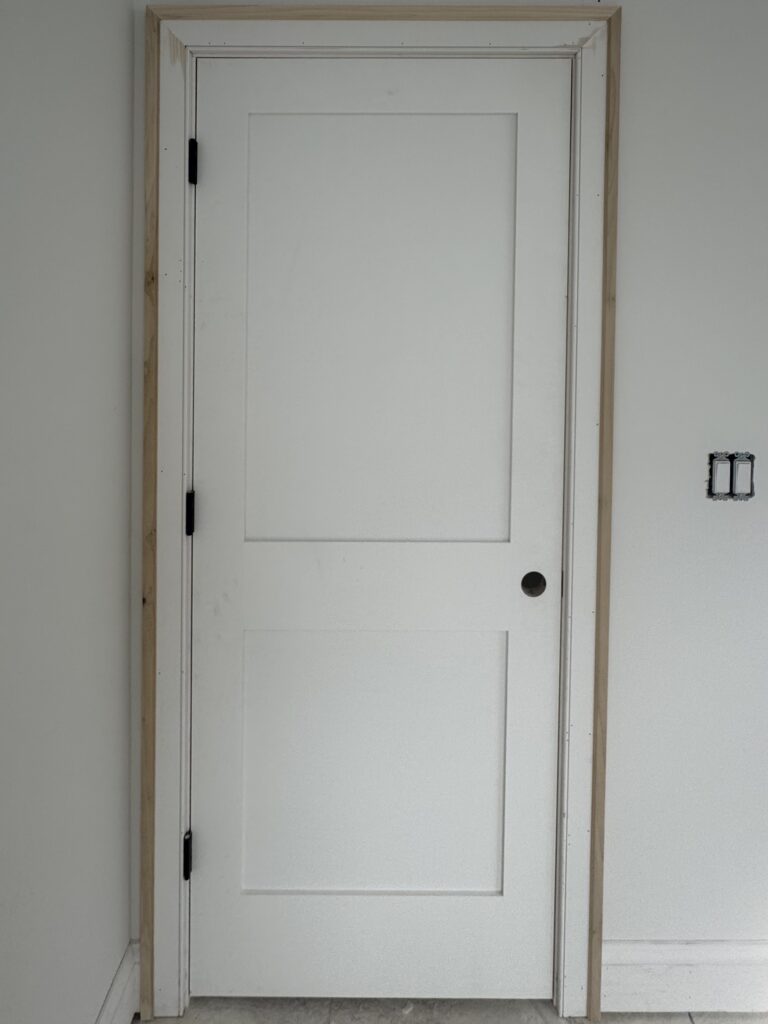 Interior doorway with proper spacing for full trim installation
